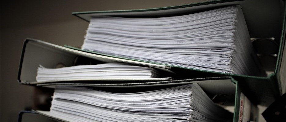 three binders stacked on top of each other